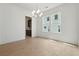 Spacious dining room featuring hardwood floors, a chandelier, and bright windows at 784 Keystone Dr, Woodstock, GA 30188