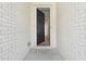 An inviting front entrance features a classic black front door and a white brick facade at 784 Keystone Dr, Woodstock, GA 30188