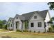 A beautiful single-story home with a brick foundation, detailed trim, and a well-manicured lawn at 784 Keystone Dr, Woodstock, GA 30188