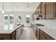 Modern kitchen with large island, stainless steel appliances, and bright white countertops at 784 Keystone Dr, Woodstock, GA 30188