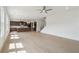 Spacious living room with hardwood floors and abundant natural light flowing from adjacent Kitchen at 784 Keystone Dr, Woodstock, GA 30188
