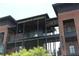 Outdoor market with multiple tiers of storefronts, black iron beams, and brickwork at 784 Keystone Dr, Woodstock, GA 30188
