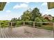 Spacious back deck with black railings and beautiful green tree views at 1231 Ellington Ct, Cumming, GA 30041