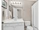 Bathroom with a large mirror, wooden vanity, white counter tops and white shower curtain at 1231 Ellington Ct, Cumming, GA 30041