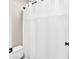 The bathroom includes a white shower curtain and toilet and dark fixtures at 1231 Ellington Ct, Cumming, GA 30041