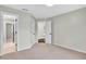 Neutral toned bedroom with multiple open doorways, plush carpeting and neutral walls at 1231 Ellington Ct, Cumming, GA 30041