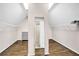 A spacious walk-in closet features hardwood floors, white shelving, and ample storage space at 1231 Ellington Ct, Cumming, GA 30041