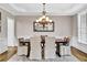 A spacious dining room with a chandelier and large dining table at 1231 Ellington Ct, Cumming, GA 30041