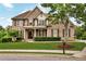 Beautiful brick home featuring a well-manicured lawn and professional landscaping at 1231 Ellington Ct, Cumming, GA 30041