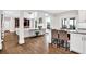 Open-concept living space showcasing hardwood floors and seamless flow to the kitchen at 1231 Ellington Ct, Cumming, GA 30041