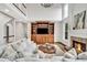Cozy living room with fireplace, custom built-ins, and plenty of natural light at 1231 Ellington Ct, Cumming, GA 30041
