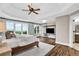 Spacious main bedroom with tray ceiling and large windows overlooking wooded area at 1231 Ellington Ct, Cumming, GA 30041