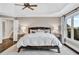 Main bedroom with tray ceiling, hard wood floors, and an abundance of light at 1231 Ellington Ct, Cumming, GA 30041