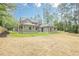 Spacious backyard with lush green grass, privacy fence and natural area at 1273 Grayson Pkwy, Grayson, GA 30017