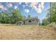 Backyard featuring the house, lawn and a new wood fence at 1273 Grayson Pkwy, Grayson, GA 30017