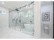 Modern bathroom featuring a large glass enclosed shower and soaking tub with great natural light at 1273 Grayson Pkwy, Grayson, GA 30017