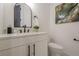 Modern powder room features a marble countertop and a sleek black faucet at 1273 Grayson Pkwy, Grayson, GA 30017