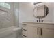 Bathroom features modern vanity, marble floors, and a tub with marble tile surround at 1273 Grayson Pkwy, Grayson, GA 30017