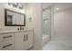 Modern bathroom with marble floors, vanity, and tiled shower at 1273 Grayson Pkwy, Grayson, GA 30017