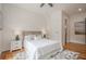 Comfortable bedroom with a queen-sized bed, hardwood floors, and neutral decor at 1273 Grayson Pkwy, Grayson, GA 30017