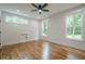Bright bedroom featuring hardwood floors, natural light, and fresh paint at 1273 Grayson Pkwy, Grayson, GA 30017