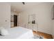 Bedroom featuring a queen-sized bed, wooden floors, and a dresser with a large mirror at 1273 Grayson Pkwy, Grayson, GA 30017