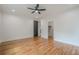 Spacious bedroom features hardwood floors, closet, and a modern ceiling fan at 1273 Grayson Pkwy, Grayson, GA 30017