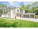 Beautiful home featuring a well-manicured lawn, a three car garage, stone accents and a grey and white color scheme at 1273 Grayson Pkwy, Grayson, GA 30017