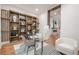 Bright office boasts custom shelving, glass desk and stylish decor at 1273 Grayson Pkwy, Grayson, GA 30017