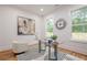 Modern home office featuring glass top desk and natural light at 1273 Grayson Pkwy, Grayson, GA 30017