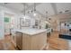 Open-concept kitchen with a large island, stainless steel appliances, and breakfast bar seating at 1273 Grayson Pkwy, Grayson, GA 30017
