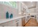 Gourmet kitchen featuring stainless appliances, quartz countertops, and custom cabinets at 1273 Grayson Pkwy, Grayson, GA 30017