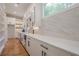 Contemporary kitchen features stainless appliances, quartz countertops, and custom cabinets at 1273 Grayson Pkwy, Grayson, GA 30017