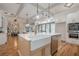 Open-concept kitchen with a large island, stainless steel appliances, and breakfast bar seating at 1273 Grayson Pkwy, Grayson, GA 30017