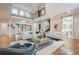 Bright living room with hardwood floors, a high ceiling, and modern furniture at 1273 Grayson Pkwy, Grayson, GA 30017
