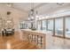 Modern kitchen with island seating and opening up to an outdoor seating area at 1273 Grayson Pkwy, Grayson, GA 30017
