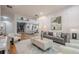 Spacious living area with a modern chandelier, comfortable seating, and open floor plan at 1273 Grayson Pkwy, Grayson, GA 30017