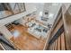 Expansive living room with a grand chandelier, fireplace, and staircase overlooking the space at 1273 Grayson Pkwy, Grayson, GA 30017