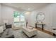 Cozy living area with modern chandelier, sleek furniture, and stylish wall accents at 1273 Grayson Pkwy, Grayson, GA 30017