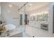 Spa-like main bathroom with soaking tub and sleek glass shower at 1273 Grayson Pkwy, Grayson, GA 30017