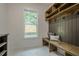 Mudroom features custom shelving, bench, and bright window at 1273 Grayson Pkwy, Grayson, GA 30017