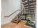 Beautiful staircase with wooden steps and a decorative water feature at 1273 Grayson Pkwy, Grayson, GA 30017
