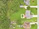 Aerial view of a home showcasing a large yard, an outdoor recreation area, and a residential neighborhood at 1419 Gates Mill Walk, Lawrenceville, GA 30045