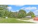 Well-maintained backyard with lush green grass and mature trees at 1419 Gates Mill Walk, Lawrenceville, GA 30045