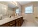 Well-lit bathroom with a modern sink, vanity, and white-tiled floor at 1419 Gates Mill Walk, Lawrenceville, GA 30045