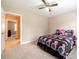 Bedroom with ceiling fan, carpeted floors, and a view to the hall at 1419 Gates Mill Walk, Lawrenceville, GA 30045