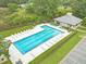 Aerial view of a community pool with lounge chairs and a pool house, perfect for relaxation and recreation at 1419 Gates Mill Walk, Lawrenceville, GA 30045
