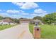 Well-maintained single-Gathering home with a lush front lawn and a spacious driveway at 1419 Gates Mill Walk, Lawrenceville, GA 30045