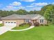 Charming brick home with a manicured lawn, an attached garage, and inviting curb appeal at 1419 Gates Mill Walk, Lawrenceville, GA 30045