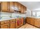 Functional kitchen with ample counter space and classic wood cabinetry at 1419 Gates Mill Walk, Lawrenceville, GA 30045